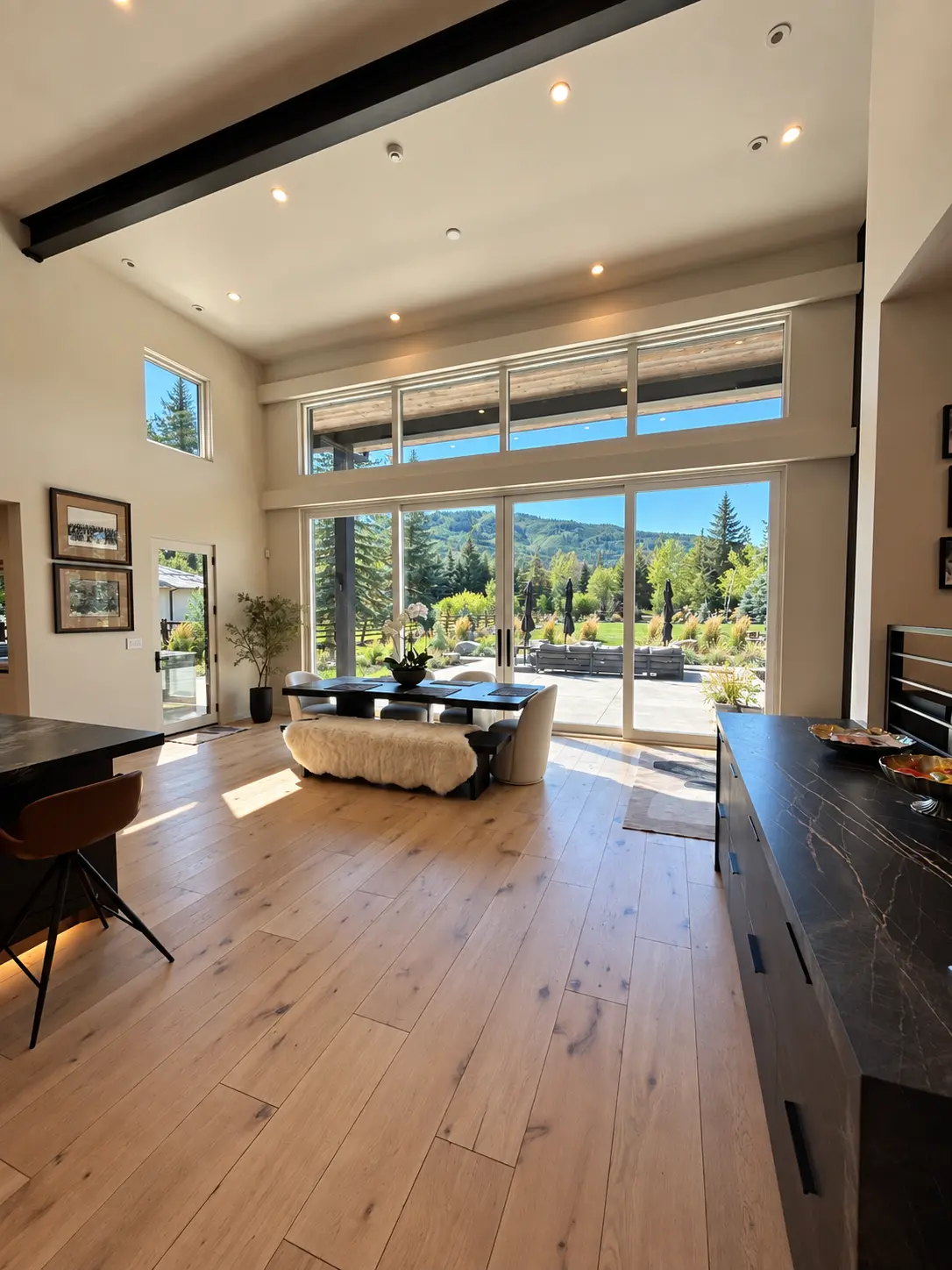 Open dining area framing mountain views through full-height glazing