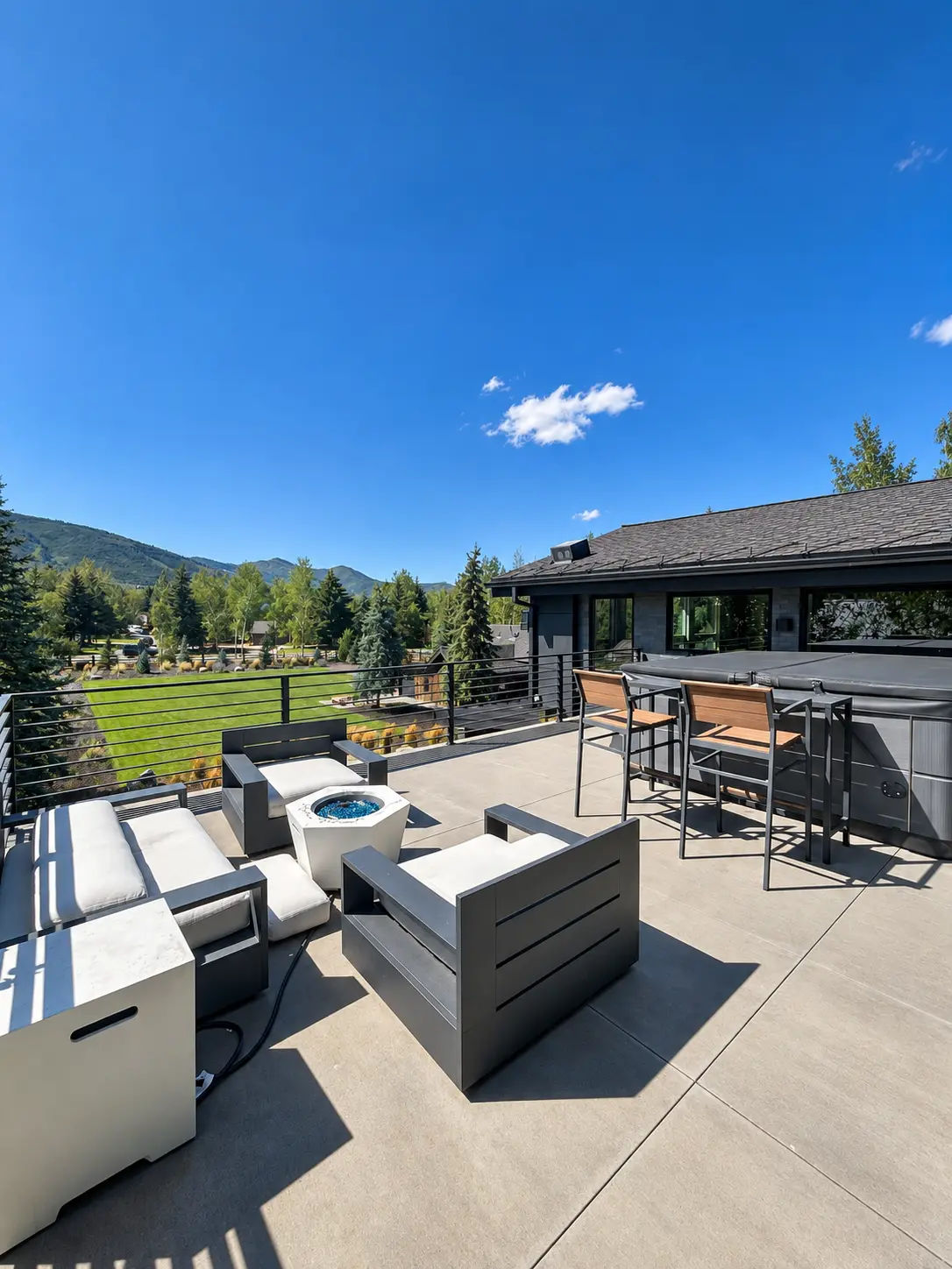 Rooftop terrace with hot tub, fire table, and Park City mountain views
